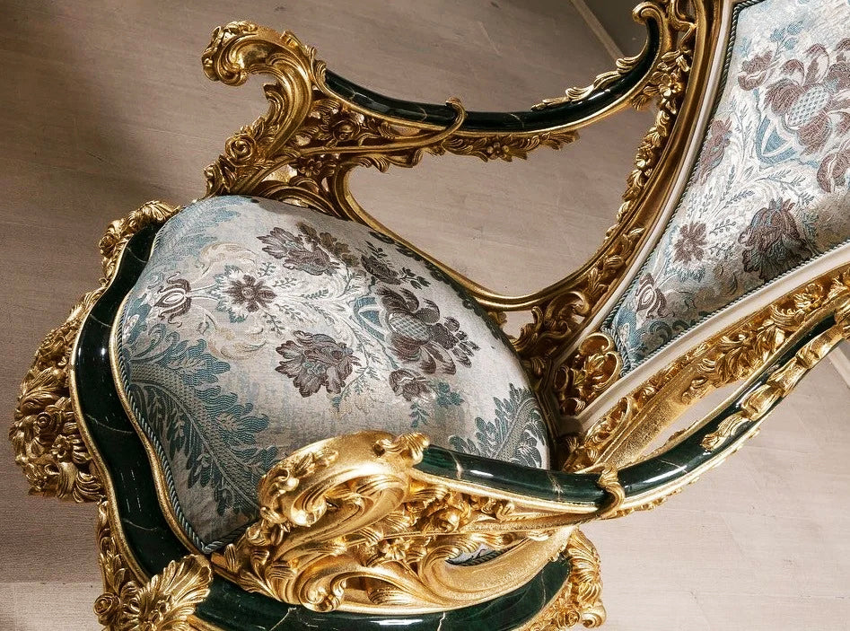 shiny and royal golden color carving on arm chair